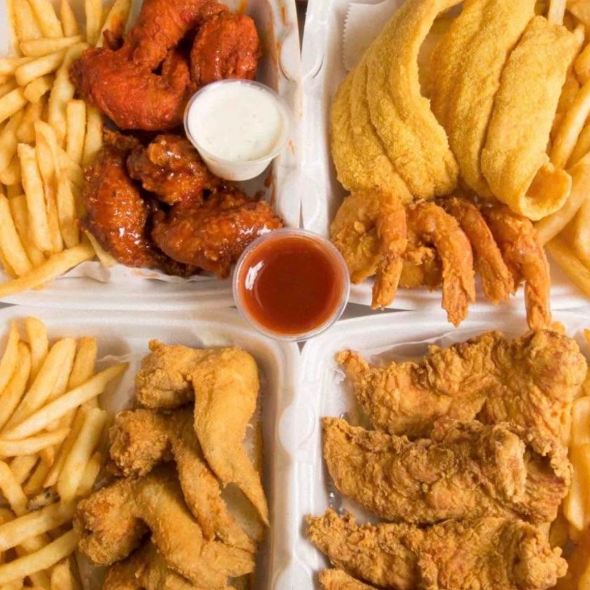 Assortment of Ocean House lunch specials with fried fish, chicken, shrimp and fries