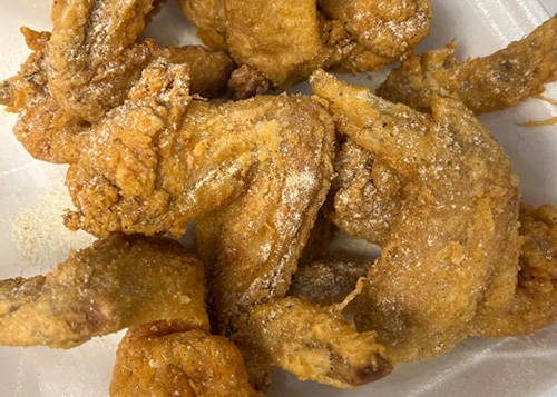 Ocean House fried chicken served fresh in a takeout container